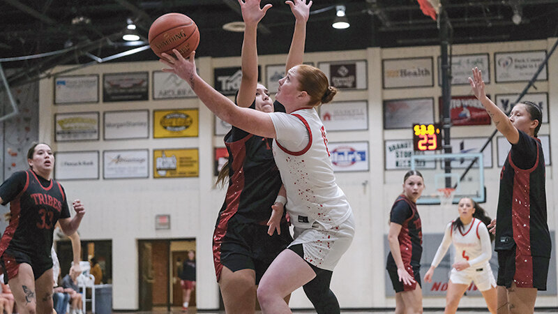 Fallon Millican (right) and the Trapper women split a pair of road contests in Rock Springs, defeating Northeastern Junior College before falling to Utah State University-Eastern. Millican is pictured during a home game in November against United Tribes.
