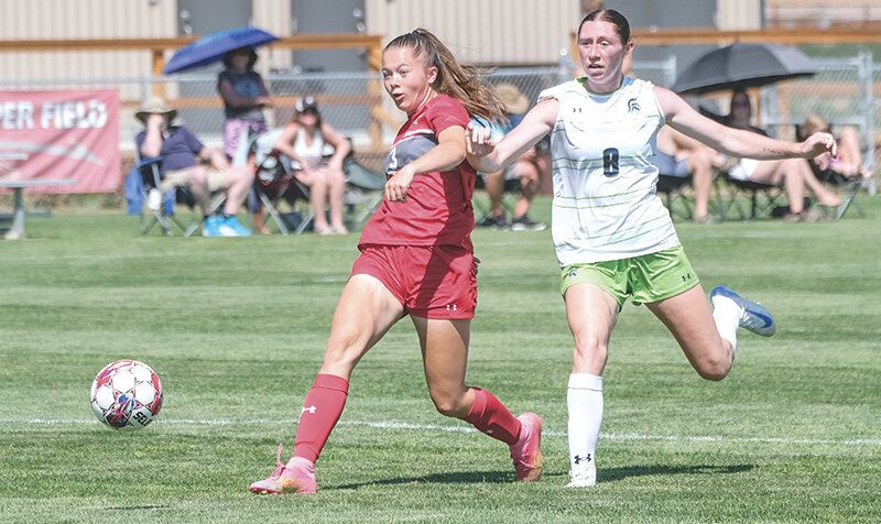 Bailey Wright (left) fires a shot during a preseason scrimmage at home. Wright got her first goal of the season on Friday in a 5-2 win over Western Nebraska.
Tribune photo by Seth Romsa