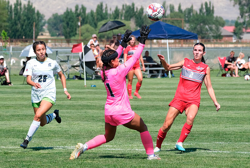 Abby Derbyshire (right) watches her shot go over the keeper during a preseason scrimmage. Derbyshire scored the lone goal for Northwest at North Idaho on Saturday.
Tribune photo by Seth Romsa