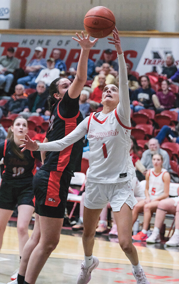 Emma Pique led the Trappers with 24 points on the road against LCCC. Pique is pictured finishing a layup at the rim against Casper College in January.