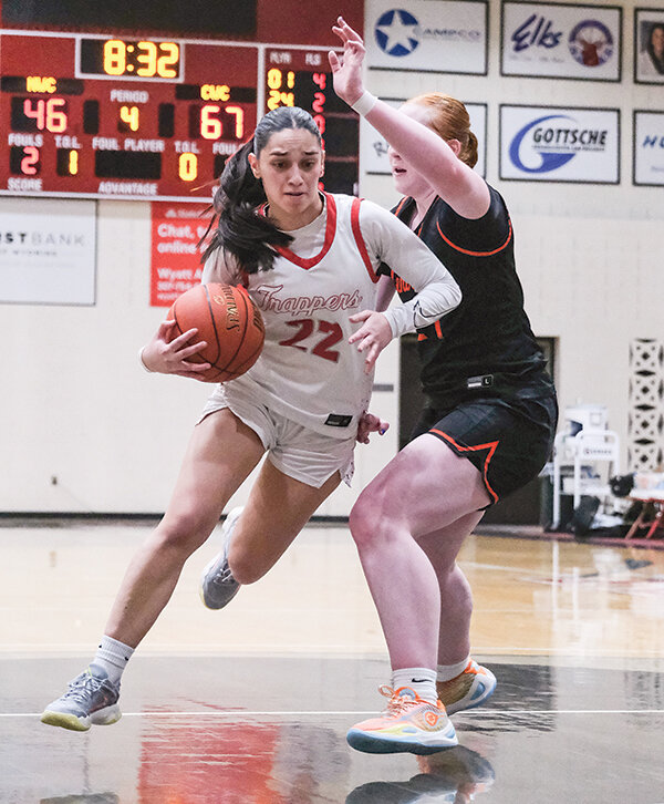Itziar Pozas (left) drives by a Central Wyoming defender on Feb. 18. Northwest needs a win against Western Wyoming Community College on Wednesday to wrap up the No. 1 seed.