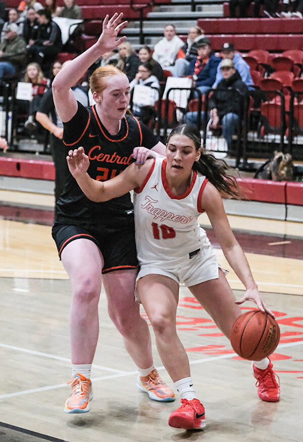 Addison Hickey (right) and the Trappers host Northeastern Junior College at 1 p.m. on Saturday. Hickey is pictured driving past a Central Wyoming defender in February.