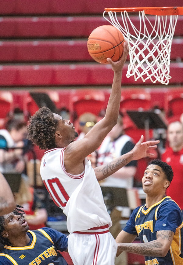 Nayel Girard and the Trappers fought but came up just short in the semifinals against Trinidad State 73-72. Girard is pictured finishing a layup against Western Nebraska in the Trappers&rsquo; play-in game.