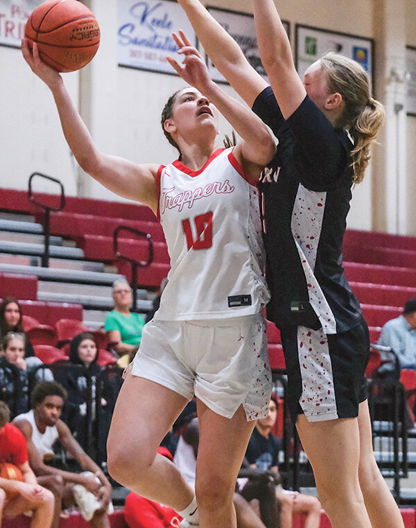 Addison Hickey (left) puts up a shot over a Western defender during the Trapper&rsquo;s home win on Jan. 21. Northwest hosted Casper on Wednesday night.