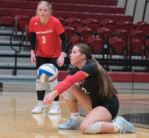 Lexie Arnold drops down to pass a ball during a home tournament match on Sept. 12. Northwest heads on the road following a canceled match to take on Casper and Gillette.