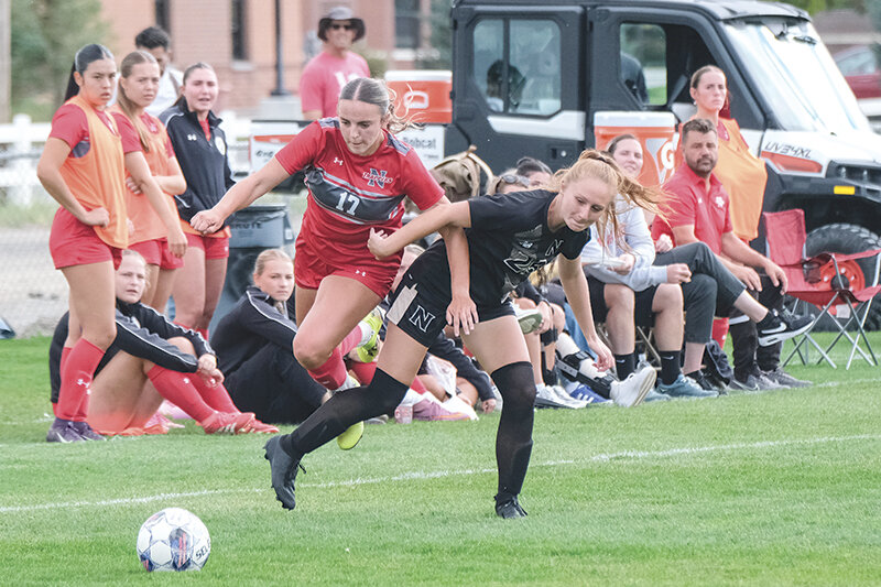 Katelyn Dandridge (left) maneuvers her way around a Northeastern defender on Saturday. Dandridge scored her first goal of the year on Friday against Lamar as the Trappers continued to roll through October.